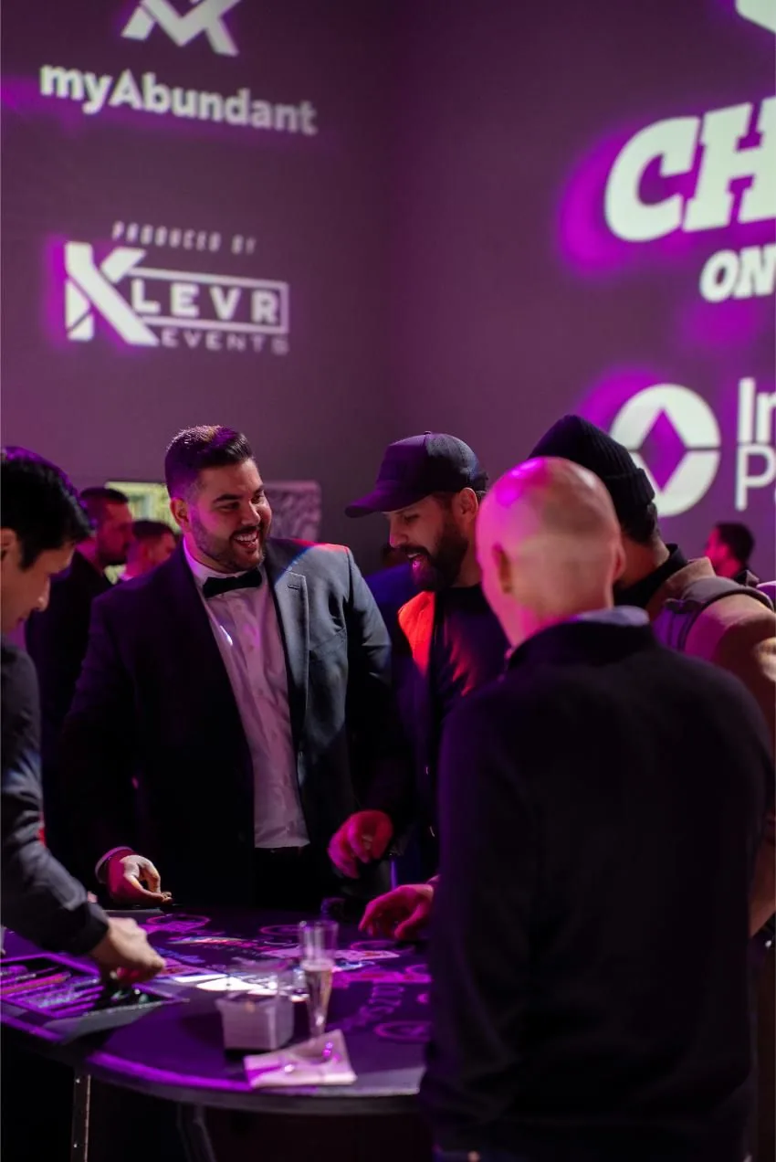 Guests playing at a custom branded table at the Bad After Dark casino after party in Las Vegas