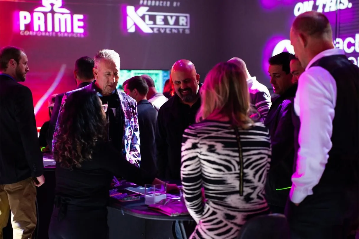 Guests crowded around a branded casino table at Bad After Dark in Las Vegas